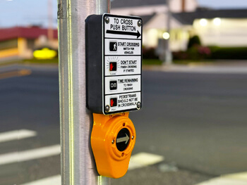 Close up view of cross walk technology system at an intersection