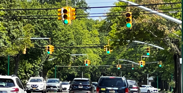 Cars driving thru an intersection