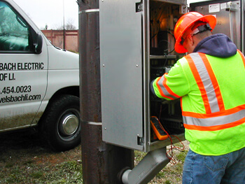 Welsbach LI electrician working on a job site